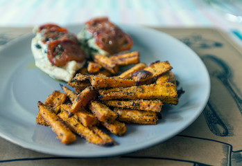 Tasty dish of roasted chicken with grilled potatoes and spices