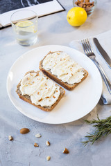 stylish pastel breakfast sandwich with bread and cottage cheese