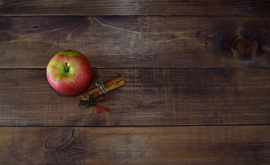 Apples with spices and cinnamon on a wooden background. Proper diet. Healthy diet. Vegetarianism. Proper Breakfast. The right snack.