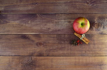 Apples with spices and cinnamon on a wooden background. Proper diet. Healthy diet. Vegetarianism. Proper Breakfast. The right snack.