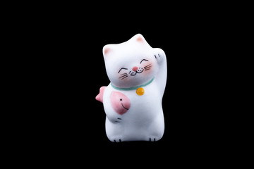 Cute lucky cat isolated on black background with clipping path