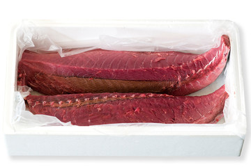 traditional fish market with tuna cut by fishmonger on  mercado dos lavradores , Funchal, Madeira Island