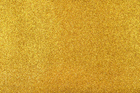 Abstract background with gold sequins texture.