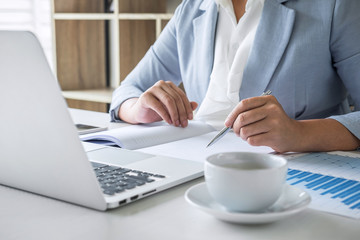 Business woman accountant financier working audit and calculating expense financial annual report...
