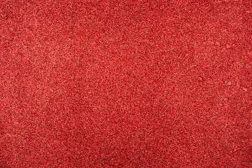 Abstract background with red sequins texture.