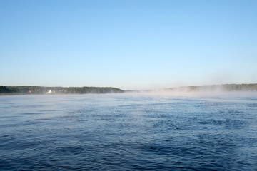 Obraz premium foggy morning on the lake and the rising mist. Forest, lake in the fog. A mysterious fog.