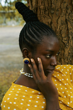 Close up of thoughtful woman standing outdoors