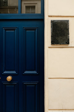 Dark Blue Door Next To White Wall