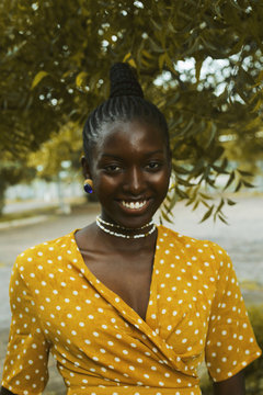 Portrait of smiling woman standing outdoors
