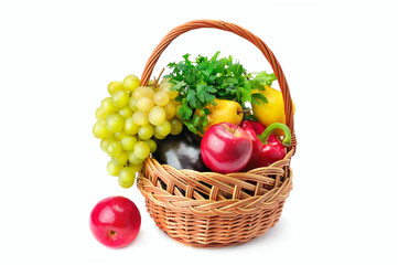 Vegetables and fruits in a basket isolated on white background.
