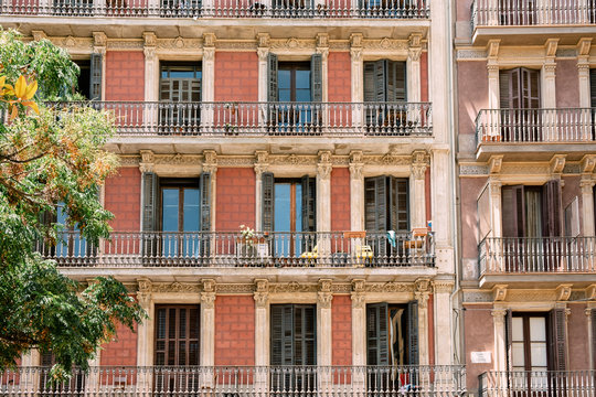 Front view of retro styled apartment building in Barcelona
