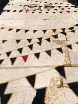 Shadow of prayer flags on street