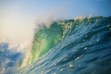 Close view of teal colored ocean wave
