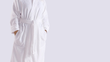 Midsection of a person in white copy-space bathrobe