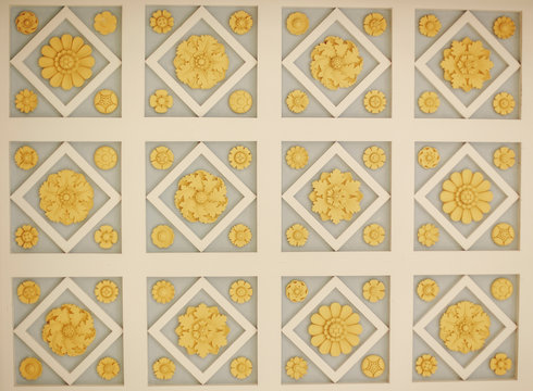 Carved floral ceiling medallions in grid