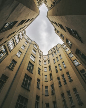 Low angle view of buildings from courtyard