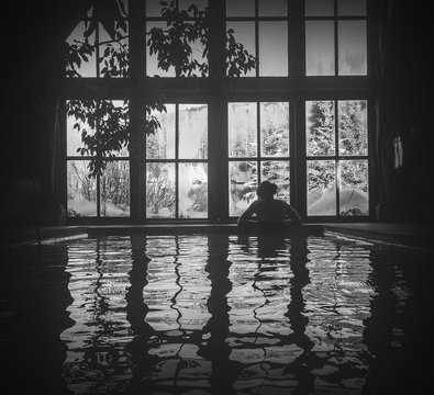 Rear View Of Woman In Indoor Pool