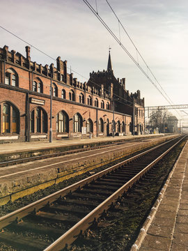 View of trains tracks running past old train station