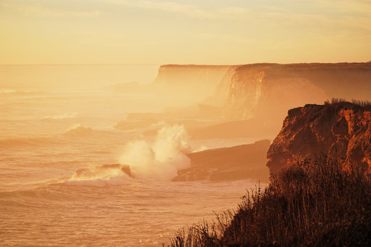 Scenic view of water at cliff