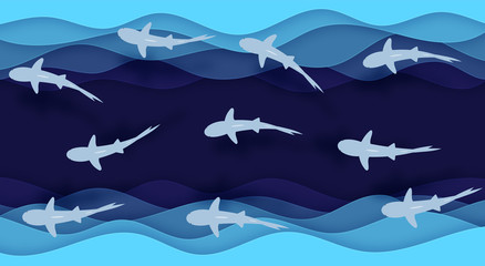 The blue waves and a pack of sharks are cut from the paper in layers, arranged one after the other. for your design. Volumetric image.