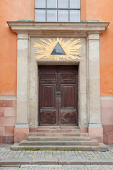 Old wooden door with carved ornaments.