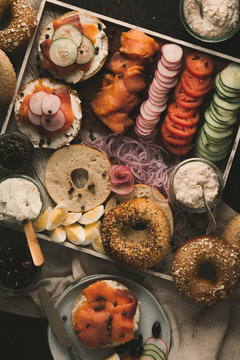 Bagels with lox spread, salmon and vegetables