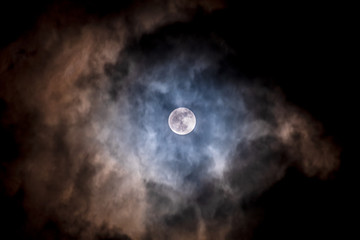 Full moon black background with clouds detail surface