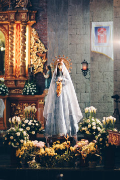 Mother Mary with flowers in church