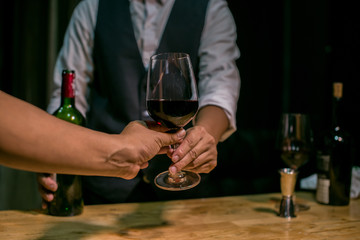man with glass of red wine