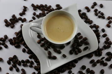 cup of coffee with cream on wooden background