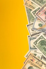 One hundred dollar banknotes on colored background top view, with empty place for your text business money concept.