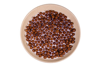 Ceramic plate with chocolate cereal balls in milk isolated on a white background