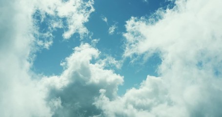 Flying through a cloudscape on a sunny day