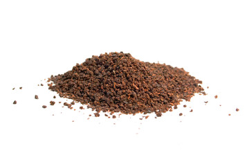 Black granular tea on a white background