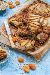 Pear, apricot, almond and oats breakfast squares - high angle view