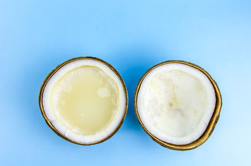 ugly food. old split coconut on a blue background