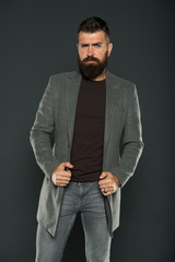 Obraz premium Brutal hipster man. Hipster wearing casual clothes. Hipster with beard hair and stylish haircut. Bearded man trendy hipster style. Warm jacket. Daily outfit. Fall fashion. Maintaining masculine look