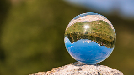 Obraz na płótnie Canvas Crystal ball alpine landscape shot at Zauchensee, Salzburg, Austria