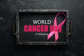 World cancer day: Breast Cancer Awareness Ribbon. Top view. Free copy space.