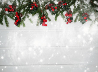 christmas decoration and garland lights on white wooden background