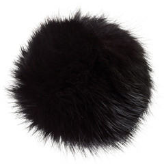 Close up of black rabbit fur pompom isolated on white background. Black fur.