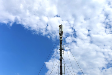 Telecommunication 5G tower. Digital wireless communication system. Basic station mobile phone. 5G of the smart antenna of a basic radiotelephone.