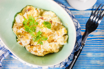 Scrambled eggs with onion.