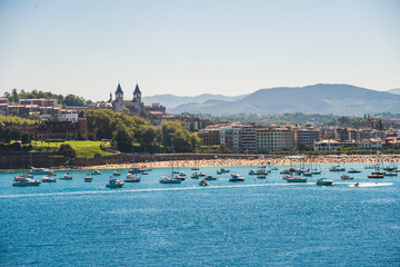 Fototapeta premium Scenic view of San Sebastian on a sunny day of summer, in Basque Country. One of the most touristic destinations in Spain