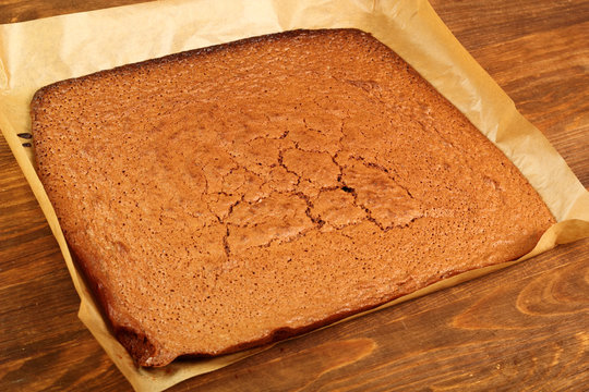 Freshly baked cake on cooking sheet
