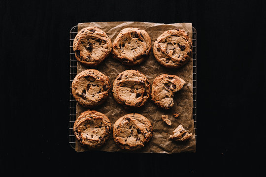 Overhead view of chocolate chip cookies on cooling rack