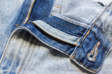 Trendy stylish jeans frayed and torn in different places.