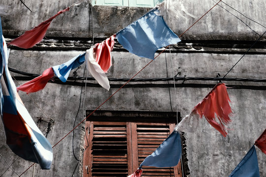 Buntings hanging against old building