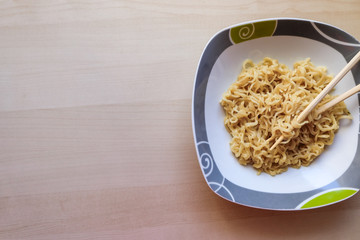 Noodles in bowl on table