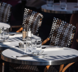 Paris cafe table with chairs and glasses with ash tray